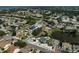Bird's eye view featuring neighborhood's layout, beautiful lake, mature trees, and well-maintained homes at 6924 34Th W Ave, Bradenton, FL 34209
