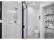Bathroom with walk in shower and glass door, white tile and modern toilet at 6924 34Th W Ave, Bradenton, FL 34209