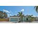 Beautiful home with a well-kept lawn, with a peek of a well-maintained fence at 6924 34Th W Ave, Bradenton, FL 34209