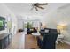 Spacious living room featuring hardwood floors, modern furniture, and a large window for ample natural light at 6924 34Th W Ave, Bradenton, FL 34209