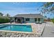 Scenic backyard with a refreshing pool, inviting lounge chairs, and a charming dining area at 6924 34Th W Ave, Bradenton, FL 34209