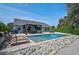 Inviting backyard oasis with a pool, lounge chairs, and a dining area perfect for outdoor relaxation and entertainment at 6924 34Th W Ave, Bradenton, FL 34209