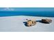 Rustic bench situated on a concrete dock with ocean views at 7 Sandy Cove Rd, Sarasota, FL 34242