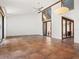 Bright and airy living room with tile flooring, a ceiling fan, and a large window at 7 Sandy Cove Rd, Sarasota, FL 34242