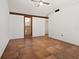 Spacious living room featuring tile flooring and a window with natural light at 7 Sandy Cove Rd, Sarasota, FL 34242