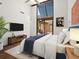 Light-filled main bedroom with plush bedding, modern décor, and an open layout to a patio at 7 Sandy Cove Rd, Sarasota, FL 34242
