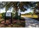 This baseball field features a sidewalk, a sign, and landscaping around the baseball field at 7168 Chatum Light Run, Bradenton, FL 34212