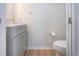 Well-lit half bathroom featuring modern vanity and toilet at 7168 Chatum Light Run, Bradenton, FL 34212