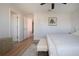Bedroom boasts a bench in front of the bed and two doors leading to other rooms at 7168 Chatum Light Run, Bradenton, FL 34212