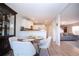 Open concept space with dining area and living room with stylish decor and natural light at 7168 Chatum Light Run, Bradenton, FL 34212