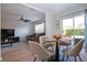 Open concept space with dining area and living room with stylish decor and natural light at 7168 Chatum Light Run, Bradenton, FL 34212