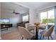 Open concept space with dining area and living room with stylish decor and natural light at 7168 Chatum Light Run, Bradenton, FL 34212
