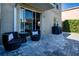 Paver patio with outdoor seating perfect for relaxing or entertaining al fresco at 7168 Chatum Light Run, Bradenton, FL 34212