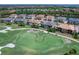 Breathtaking aerial shot of the home in a beautiful community with golf course and lush landscaping at 7425 Divot Loop, Lakewood Ranch, FL 34202
