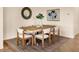 Inviting dining room featuring a wooden table with seating for six at 7425 Divot Loop, Lakewood Ranch, FL 34202