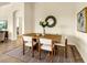Cozy dining area with wooden table, seating for four, and stylish decor at 7425 Divot Loop, Lakewood Ranch, FL 34202