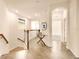 Hallway in multi-Gathering home featuring tile flooring and an arched doorway at 7425 Divot Loop, Lakewood Ranch, FL 34202
