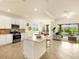 Modern kitchen with stainless steel appliances and a center island at 7425 Divot Loop, Lakewood Ranch, FL 34202
