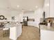 Modern kitchen with stainless steel appliances and an adjacent dining area at 7425 Divot Loop, Lakewood Ranch, FL 34202