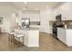Bright, modern kitchen with stainless appliances and a center island at 7425 Divot Loop, Lakewood Ranch, FL 34202