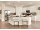 Well-lit kitchen featuring stainless appliances and breakfast bar seating at 7425 Divot Loop, Lakewood Ranch, FL 34202