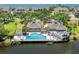 Aerial view of community pool and clubhouse overlooking the water at 78 Tidy Island Blvd, Bradenton, FL 34210