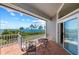 Enjoy beautiful water views from this relaxing balcony with comfortable seating and a charming tile floor at 78 Tidy Island Blvd, Bradenton, FL 34210