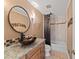 Stylish bathroom featuring a granite countertop, vessel sink, and tiled shower/tub enclosure at 78 Tidy Island Blvd, Bradenton, FL 34210