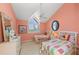 Charming bedroom decorated with twin beds, bright colors, and plenty of natural light at 78 Tidy Island Blvd, Bradenton, FL 34210