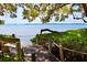 Scenic waterfront dock with bench seating, offering breathtaking views of the tranquil bay and sky at 78 Tidy Island Blvd, Bradenton, FL 34210