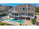 Elegant waterfront home with a private pool and lush landscaping at 78 Tidy Island Blvd, Bradenton, FL 34210