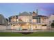 Beautiful waterfront home with a fenced yard, patio, and lovely landscaping at 78 Tidy Island Blvd, Bradenton, FL 34210