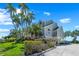Beautifully landscaped waterfront home with lush, mature foliage and ample parking at 78 Tidy Island Blvd, Bradenton, FL 34210