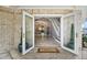 Grand foyer with marble floors, elegant decor, and a staircase at 78 Tidy Island Blvd, Bradenton, FL 34210
