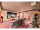 Home theater with reclining seats, plush carpeting, and large screen for immersive entertainment at 78 Tidy Island Blvd, Bradenton, FL 34210