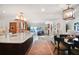 Open concept kitchen with a large island, stone counters, and seamless flow into the living space at 78 Tidy Island Blvd, Bradenton, FL 34210