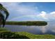 Stunning lake view with a vibrant rainbow arcing across the sky, reflecting on the calm water at 78 Tidy Island Blvd, Bradenton, FL 34210