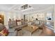 Comfortable living room features hardwood floors, a decorative ceiling and plush leather seating at 78 Tidy Island Blvd, Bradenton, FL 34210