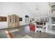 Open living room features hardwood floors, high ceilings, and abundant natural light from surrounding windows at 78 Tidy Island Blvd, Bradenton, FL 34210
