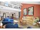 Open-concept living room with lots of natural light, a fireplace, and an adjacent kitchen area at 78 Tidy Island Blvd, Bradenton, FL 34210