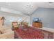 Open living room featuring a loft, skylights, comfortable seating and entertainment center at 78 Tidy Island Blvd, Bradenton, FL 34210