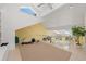 Bright loft area with skylights, neutral carpet, and glass railing overlooking the lower level at 78 Tidy Island Blvd, Bradenton, FL 34210