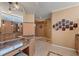 Luxurious bathroom with dual vanities, a makeup counter, granite countertops, and custom tile flooring at 78 Tidy Island Blvd, Bradenton, FL 34210