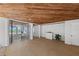 Covered patio with brick flooring leading to an outdoor space with ocean view at 78 Tidy Island Blvd, Bradenton, FL 34210