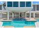 Pool and jacuzzi on a patio, offering a relaxing outdoor experience with a view of the surrounding nature at 78 Tidy Island Blvd, Bradenton, FL 34210