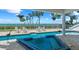 Backyard pool with a jacuzzi, chairs, plants, and views of the water, creating a tranquil setting at 78 Tidy Island Blvd, Bradenton, FL 34210