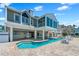 Beautiful backyard featuring a private pool, jacuzzi, and spacious patio for outdoor entertaining at 78 Tidy Island Blvd, Bradenton, FL 34210