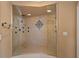Spacious tiled shower features a mosaic tile design and multiple shower heads at 78 Tidy Island Blvd, Bradenton, FL 34210