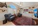 Inviting sitting room with plush armchairs, custom built-ins and an area rug at 78 Tidy Island Blvd, Bradenton, FL 34210