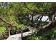 Scenic wooden walkway with rope railings winds through lush foliage, offering a peaceful nature escape at 78 Tidy Island Blvd, Bradenton, FL 34210